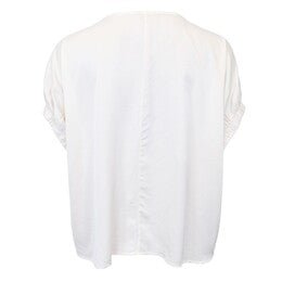 Bagfra-billede af en sort Mabel-bluse i off-white til kvinder, med løs pasform og opsmøgede ærmer, vist på hvid baggrund.