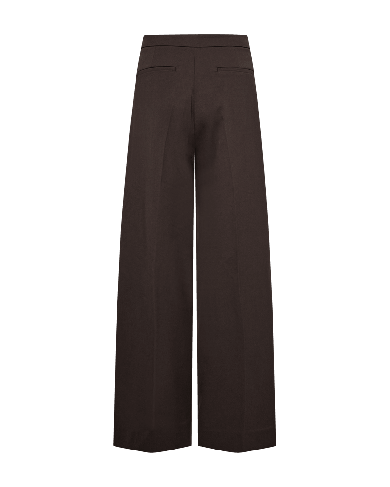 Bagsiden af de højtaljede Copenhagen Muse Tailor Mørkebrun-bukser med brede ben, to stiklommer og ingen synlige lukninger.