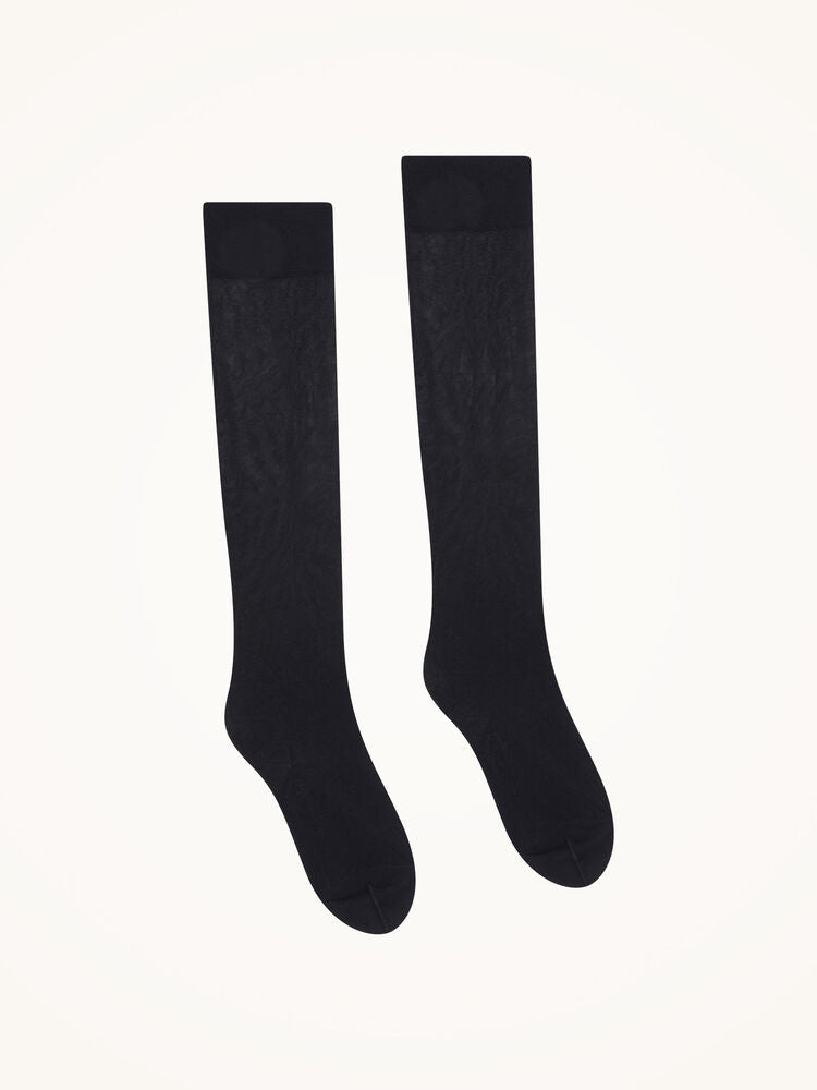 Wolford Satin Touch 20 Black W knæstrømper fra Wolford vist på en hvid baggrund.