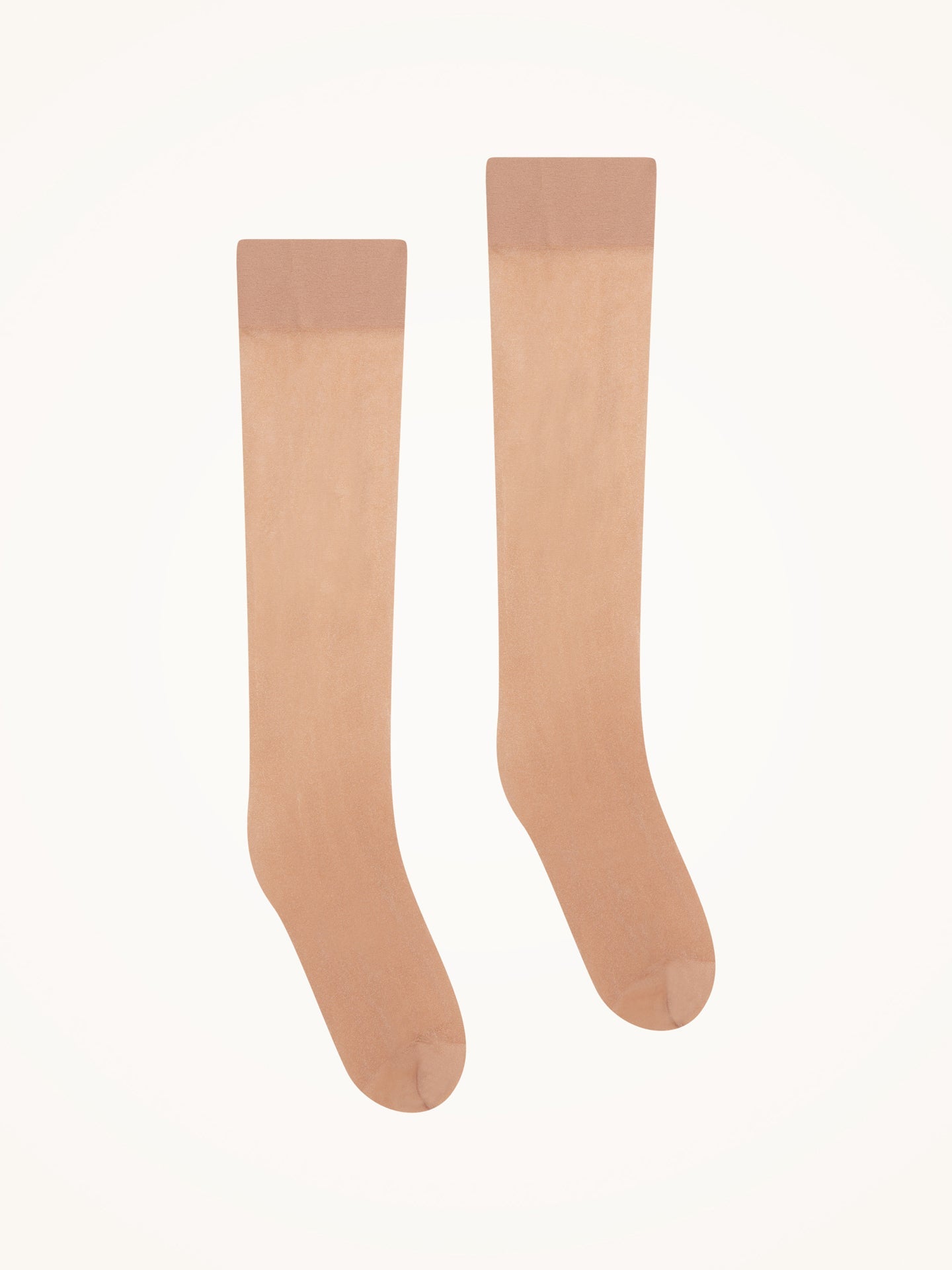 Wolford Satin Touch 20 Gobi: gennemsigtige, hudfarvede knæstrømper vist på en ensfarvet hvid baggrund.