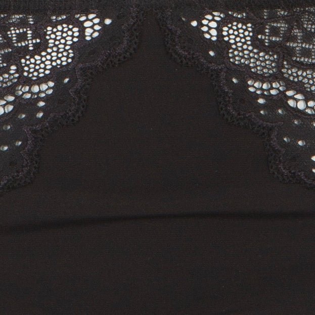 Nærbillede af Simone Perele – Caresse 015 Sort stof med blonder, perfekt til højtaljede maxi-trusser.